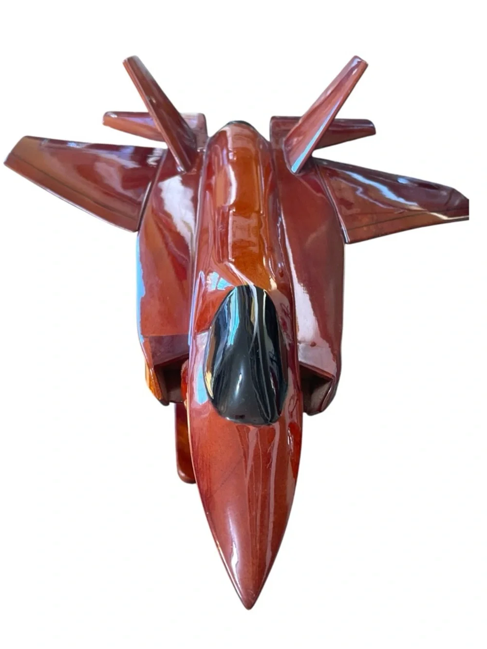 Mahogany wood model of a stealth fighter jet, handcrafted